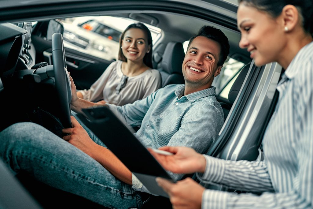 at a car dealership, buying a car