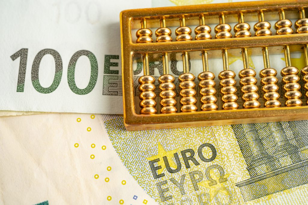 gold abacus on euro banknote money, economy finance exchange tra